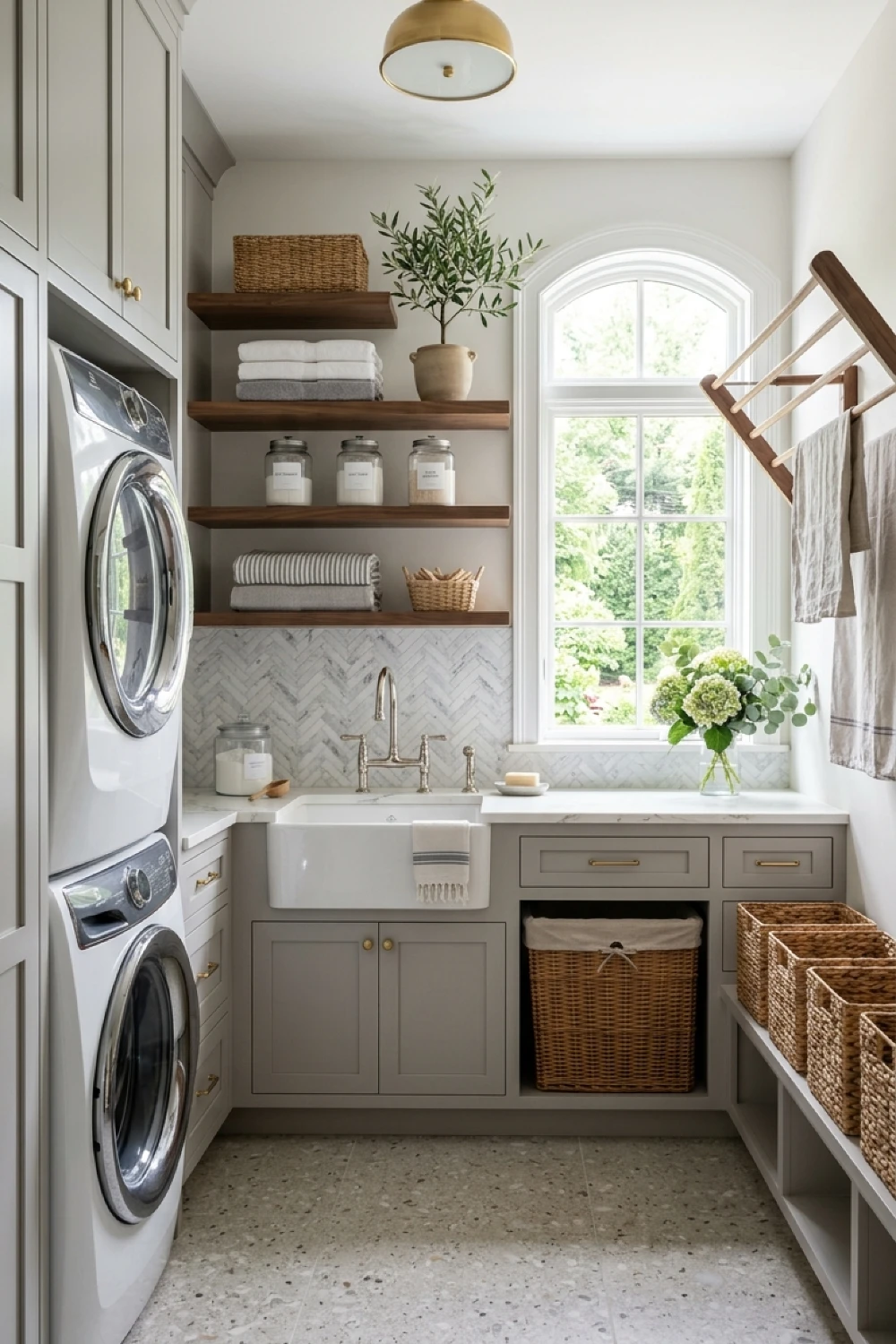 22-elegant-laundry-room-ideas-to-transform-your-daily-routine-arched-window-views-and-terrazzo-flooring.webp